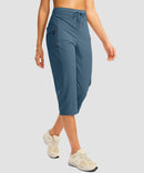 women's 3 zipper pockets hiking capri pants in indigo blue - side view