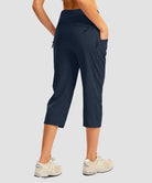 women's 3 zipper pockets hiking capri pants in navy - back view