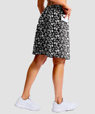 women's 4 pockets knee length golf skort in black flower - back view