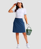 women's 4 pockets knee length golf skort in dark blue - front view