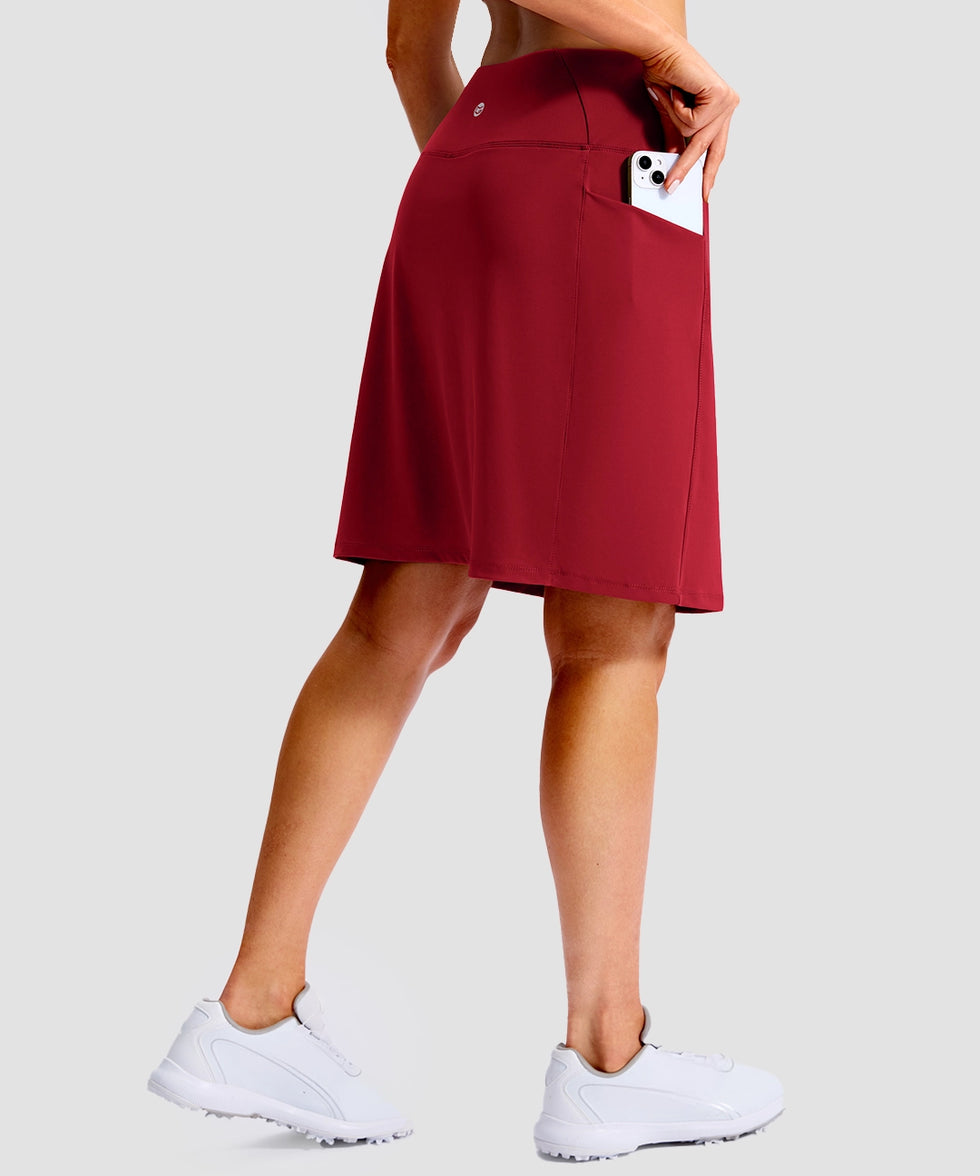 women's 4 pockets knee length golf skort in dark red - front view