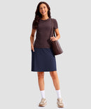 women's 4 pockets knee length golf skort in navy - front view