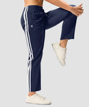 women's contrast stripe zip pockets track pants 28'' in navy - side view