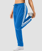 women's contrast stripe zip pockets track pants 30''/32'' in lake blue - side view