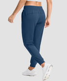 women's drawstring mid waist joggers in dark blue - back view