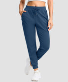 women's drawstring mid waist joggers in dark blue - front view