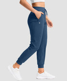 women's drawstring mid waist joggers in dark blue - pocket detail