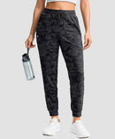 women's drawstring mid waist joggers in gray camo - front view