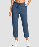 women's drawstring with pockets ankle pants in dark blue - front view