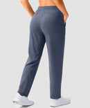 women's elastic waist 2 zip pockets track pants in dusty blue - back view