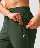 women's elastic waist 2 zip pockets track pants in olive green - pocket detail view