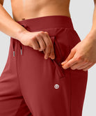 women's elastic waist 2 zip pockets track pants in savannah red - pocket detail view