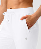 women's elastic waist 2 zip pockets track pants in white - pocket detail view