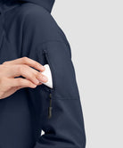 women's fleece-lined softshell jacket in navy - zipper pocket detail view