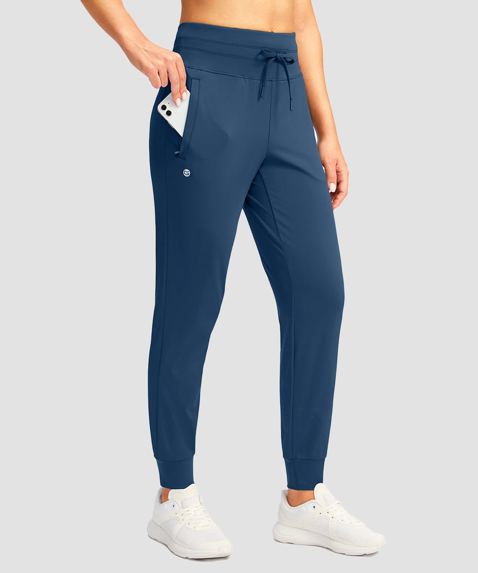 women's high-rise stretchy athletic joggers in dark blue - pocket detail