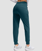 women's high rise fleece-lined joggers in dark blue - back view