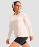 women's hip-length workout long sleeve in beige - fabric detail view