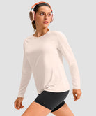 women's hip-length workout long sleeve in beige - fabric detail view