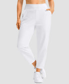women's pull-on stretchy ankle pants in white - zipper pocket detail view