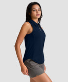 women's sleeveless zip up polo shirts in navy - side view