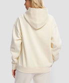 women's solid color oversized fleece hoodie in beige - back view