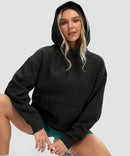 women's solid color oversized fleece hoodie in black - collar detail view