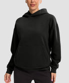 women's solid color oversized fleece hoodie in black - front view