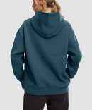 women's solid color oversized fleece hoodie in dark blue - back view