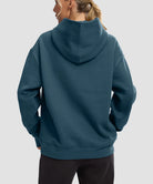 women's solid color oversized fleece hoodie in dark blue - back view