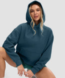women's solid color oversized fleece hoodie in dark blue - collar detail view