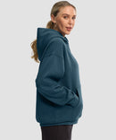 women's solid color oversized fleece hoodie in dark blue - side view