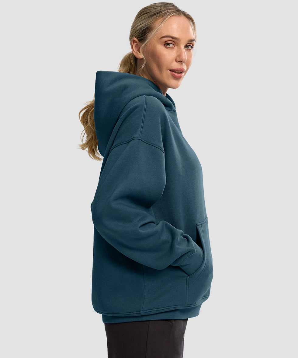 women's solid color oversized fleece hoodie in dark blue - side view