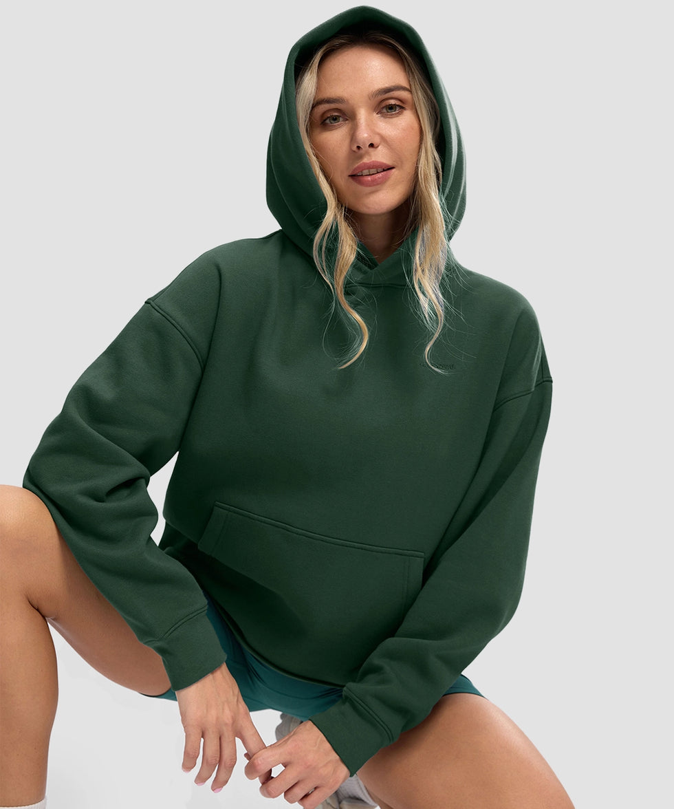 women's solid color oversized fleece hoodie in dark green - collar detail view