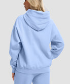women's solid color oversized fleece hoodie in light blue - back view