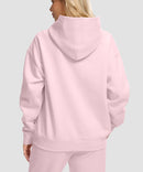 women's solid color oversized fleece hoodie in pink - back view
