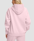 women's solid color oversized fleece hoodie in pink - back view