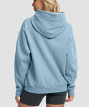 women's solid color oversized fleece hoodie in slate blue - back view