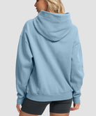 women's solid color oversized fleece hoodie in slate blue - back view