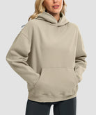 women's solid color oversized fleece hoodie in taupe - front view