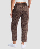 women's stretchy golf pants ankle-length in brown leopard - back view