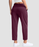 women's stretchy golf pants ankle-length in date red - back view