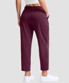 women's stretchy golf pants ankle-length in date red - back view