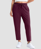women's stretchy golf pants ankle-length in date red - front view