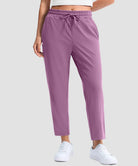 women's stretchy golf pants ankle-length in dusty purple - front view
