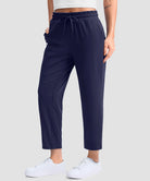 women's stretchy golf pants ankle-length in navy - side view