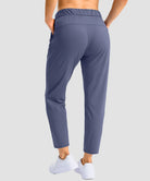 women's stretchy waist with pocket ankle pants in indigo blue - back view