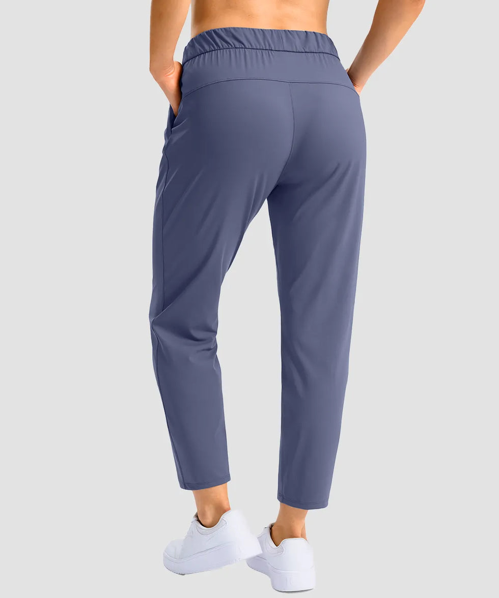 women's stretchy waist with pocket ankle pants in indigo blue - back view
