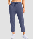 women's stretchy waist with pocket ankle pants in indigo blue - front view