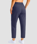 women's stretchy waist with pocket ankle pants in navy - back view
