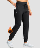 women's ultra high rise fleece-lined joggers in black - pocket details view